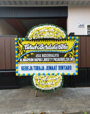 Papan Bunga Duka di Botomuzoi
